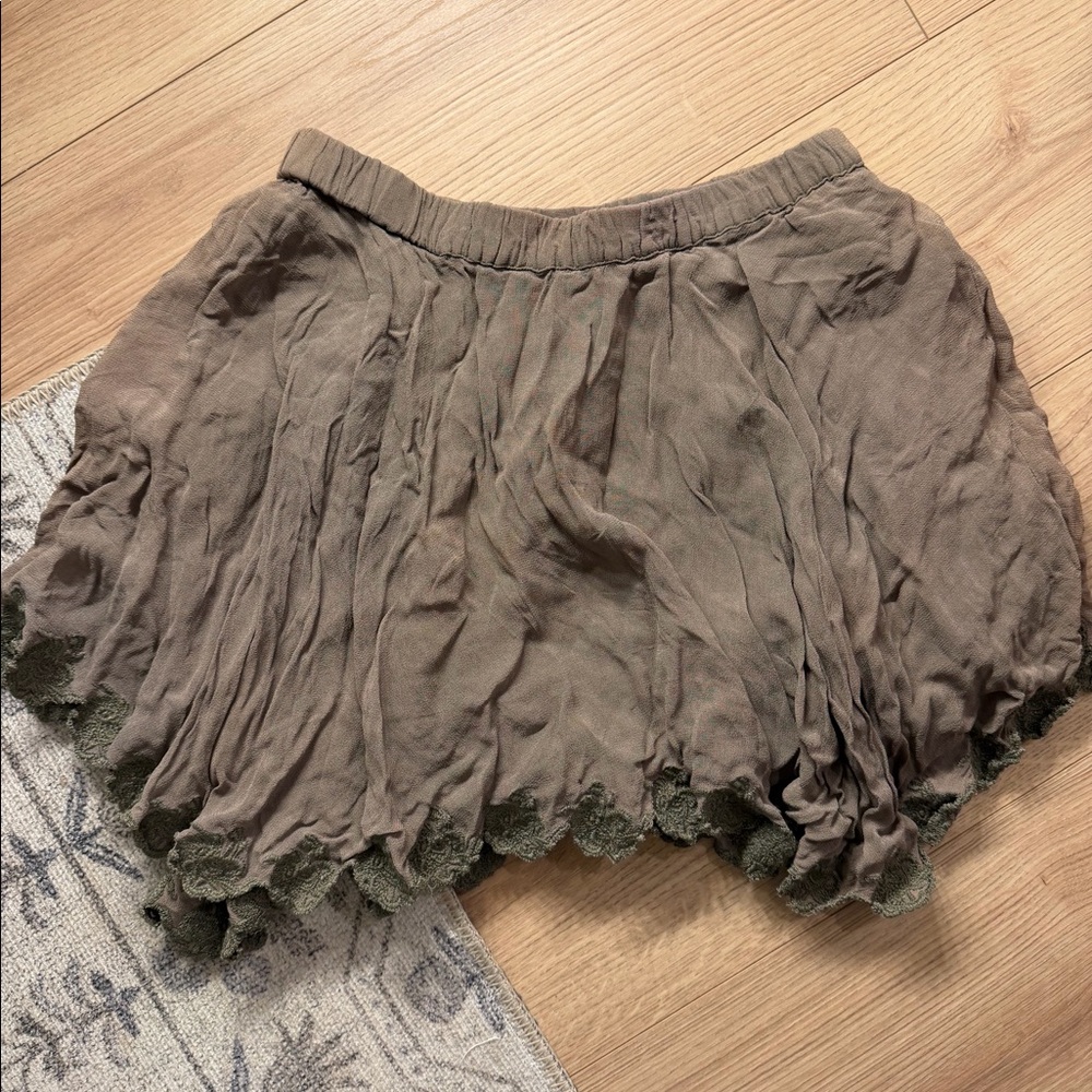 Green asymmetrical mini skirt